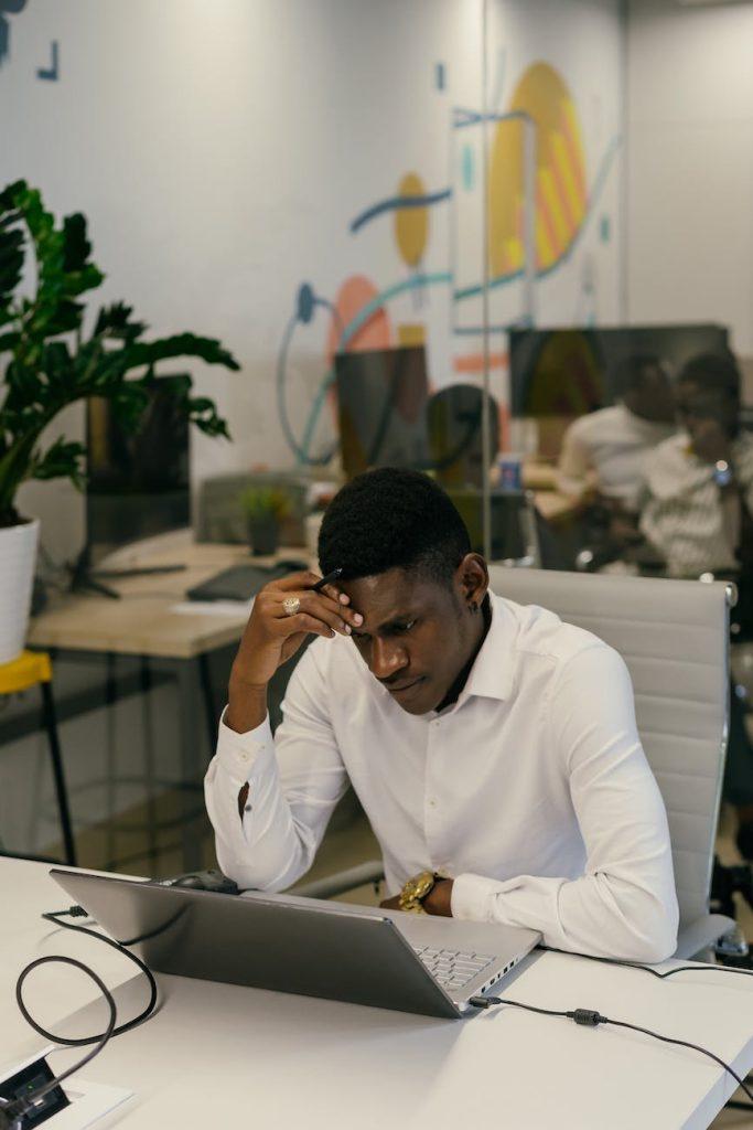 Content Marketing Ideas, a man in white long sleeves shirt sitting behind his desk