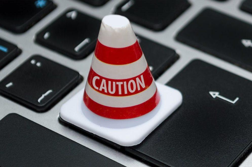 What you need to know about GDPR  - white caution cone on keyboard